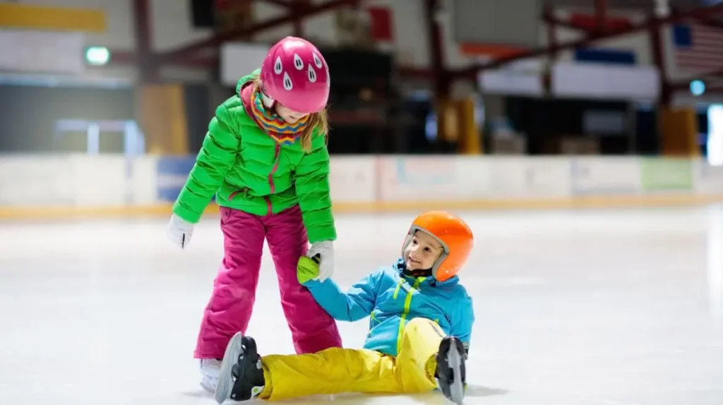 Commercial Maintenance Empowering Winter Sports: Supporting Youth Programs in East Grand Forks, MN 1 Kids ice skating at ice rink bright clothes istock 0 Landscaping and Lawn Care Services | PRO Land | Snow | Grand Forks, MN