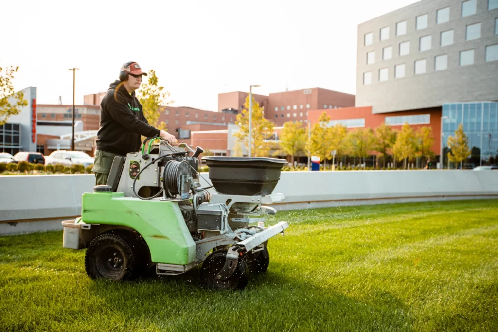 Commercial Landscaping Hospital Lawn Care Crew Technician Granular Fertilization 3 Landscaping and Lawn Care Services | PRO Land | Snow | Grand Forks, MN